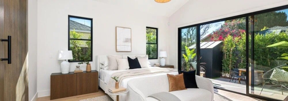 Coastal Townhomes bright bedroom with garden views